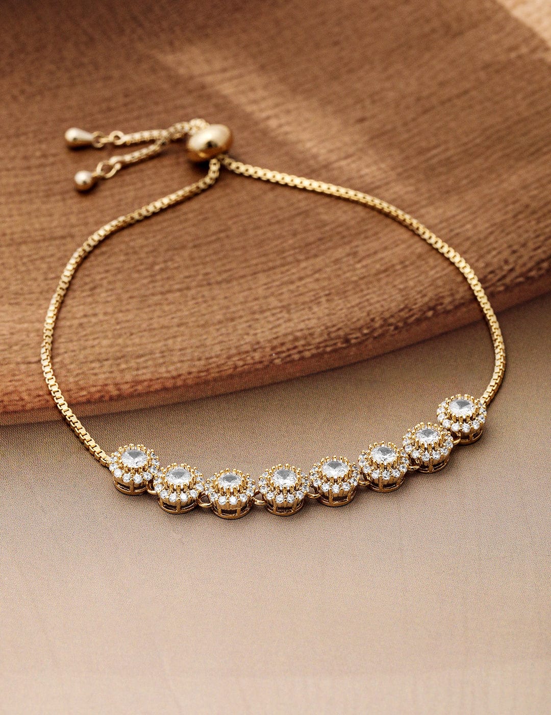 18k-gold-plated-cubic-zirconia-studded-bracelet-with-round-charm-accents-bracelet-36940856623278.jpg