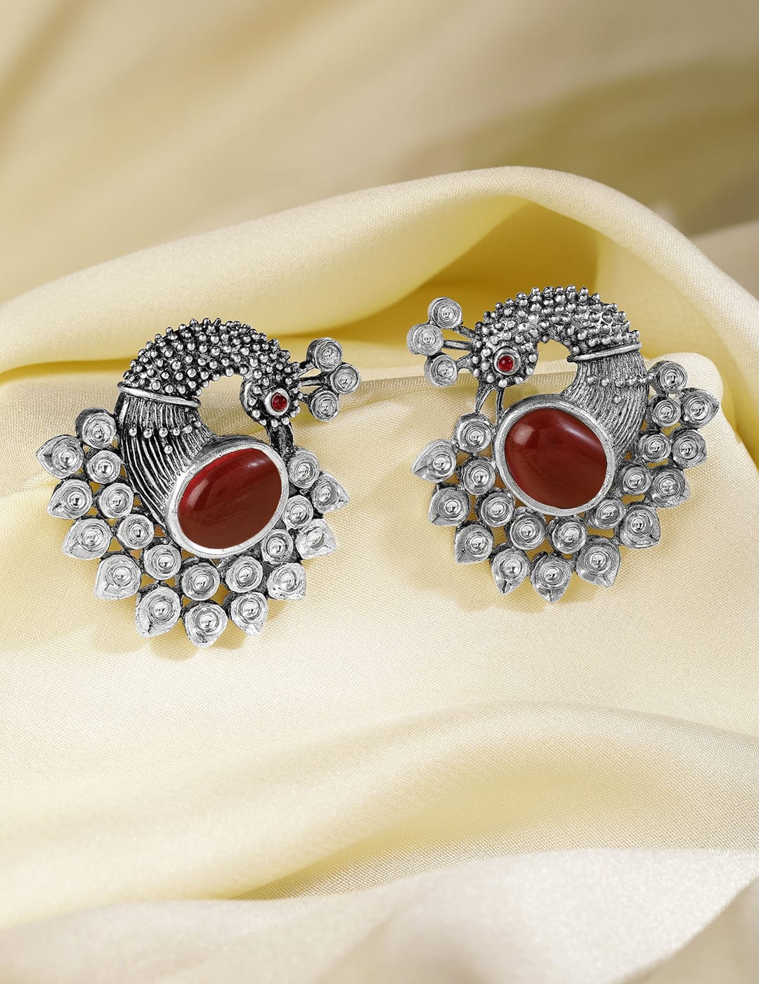 oxidized-silver-plated-peacock-motif-stud-earrings-with-ruby-studded-studs-36940896895150.jpg