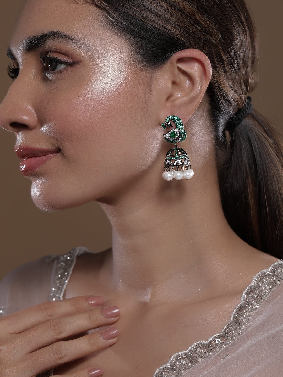 rhodium-plated-emerald-cubic-zirconia-studded-pearl-drops-peacock-design-jhumka-earrings-jhumkas-36940753633454.jpg