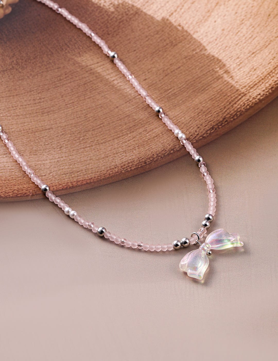 rhodium-plated-pink-beaded-necklace-with-iridescent-butterfly-bow-pendant-necklace-and-chains-36954403864750.jpg