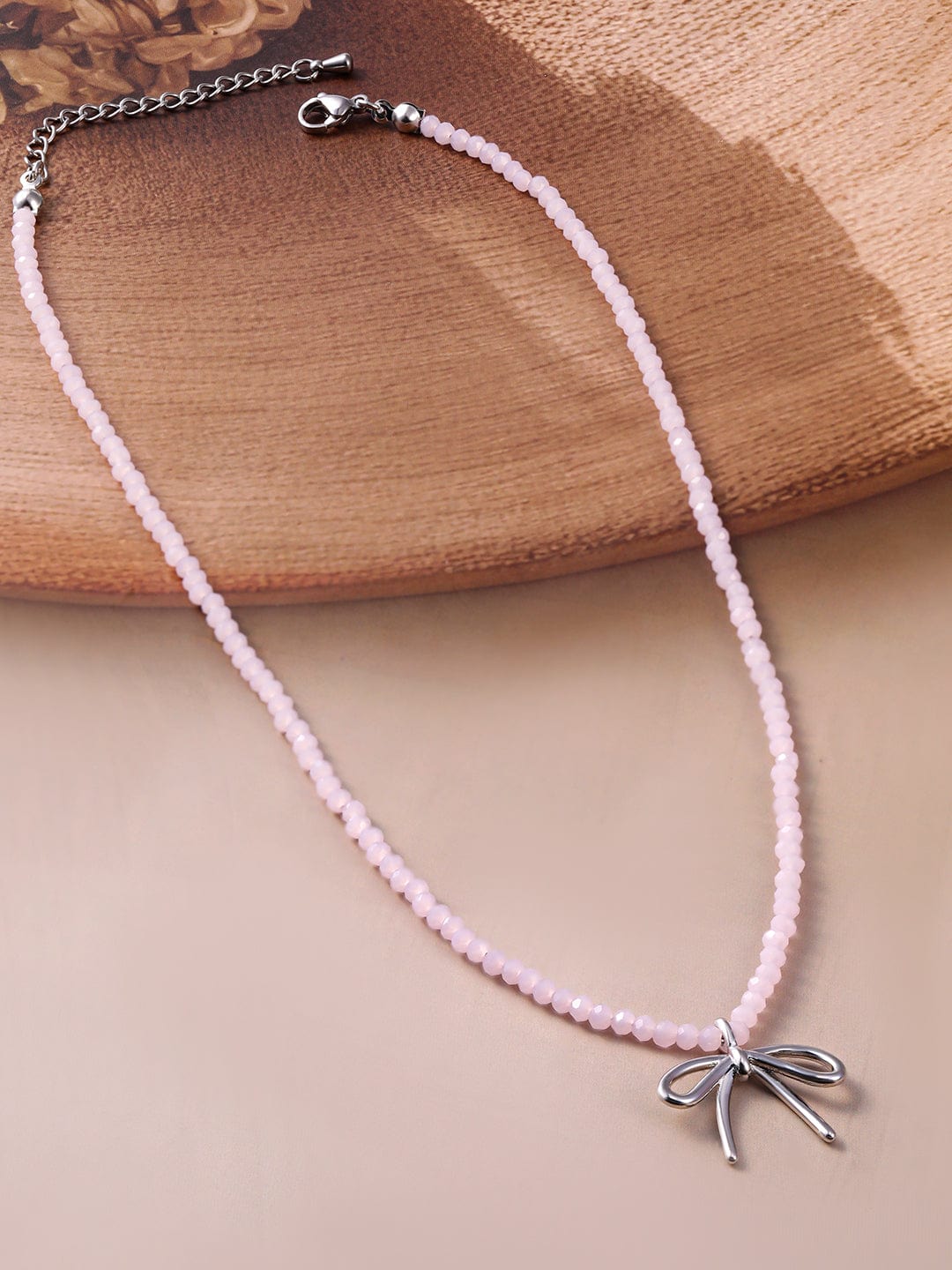 rhodium-plated-soft-pink-beaded-necklace-with-silver-bow-pendant-necklace-and-chains-36954406977710.jpg
