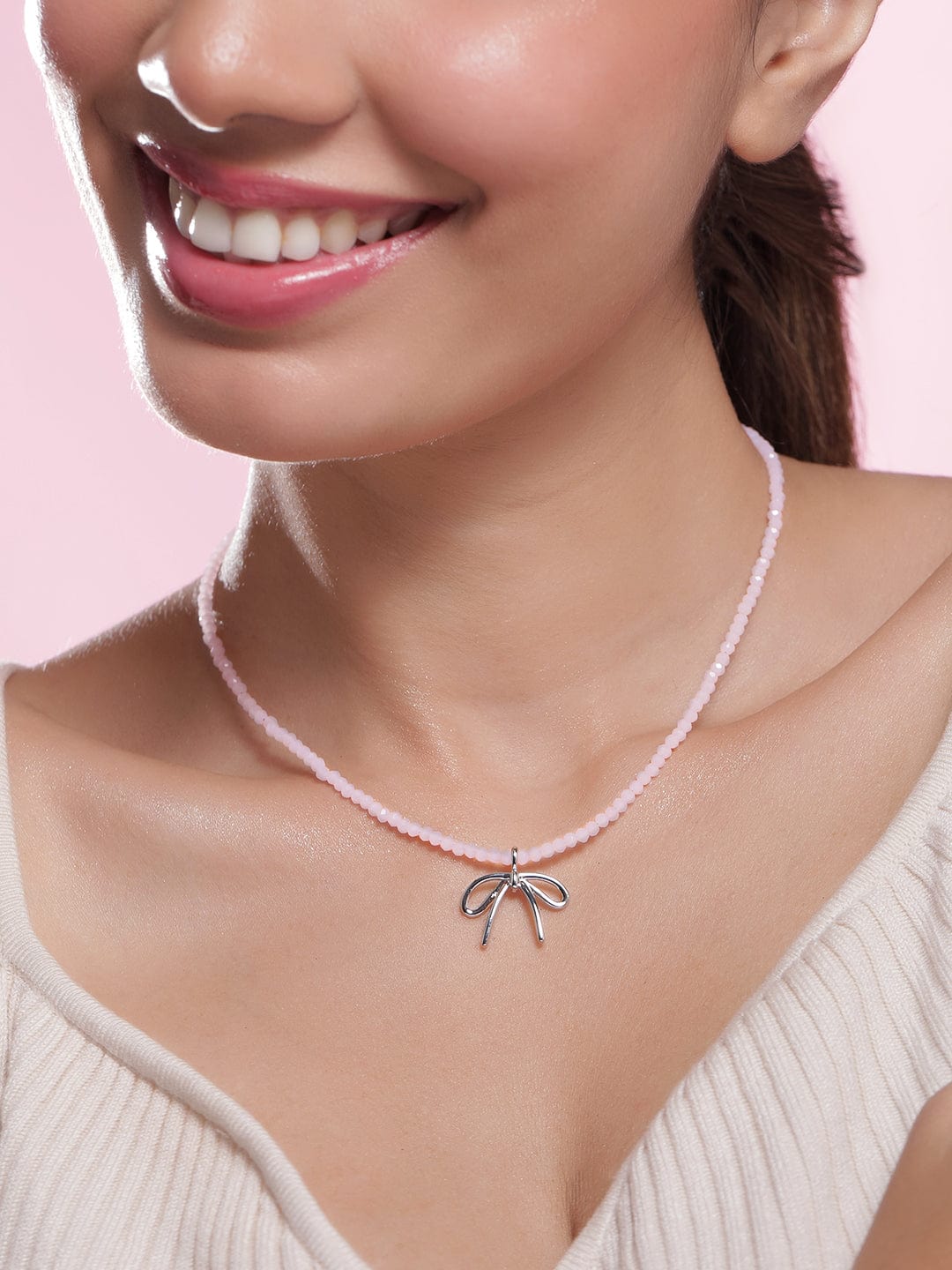 rhodium-plated-soft-pink-beaded-necklace-with-silver-bow-pendant-necklace-and-chains-36954407076014.jpg