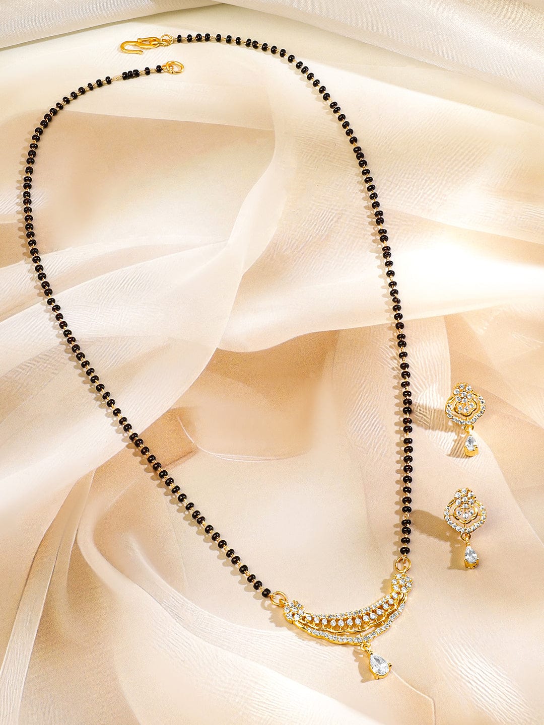rubans-18k-gold-plated-white-cubic-zirconia-studded-curved-bar-mangalsutra-set-with-black-beaded-chain-earrings-mangalsutra-set-1170454784.jpg