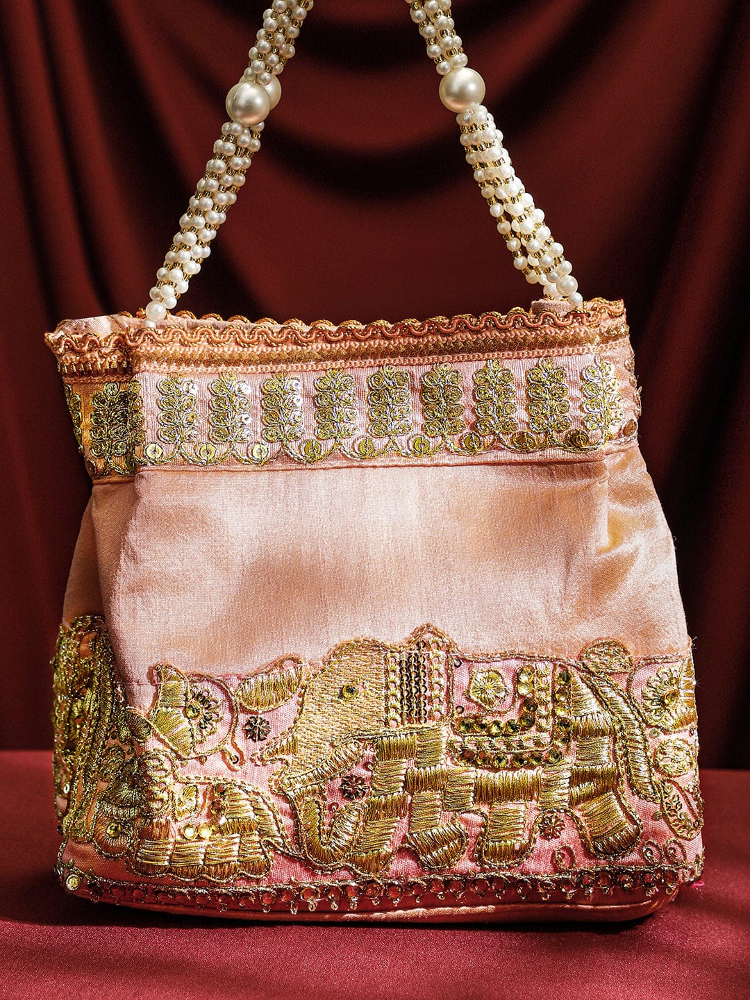 rubans-handcrafted-peach-pink-silk-potli-bag-with-pearl-handle-gold-embroidered-elephant-motif-handbag-wallet-accessories-clutche-1158545760.jpg