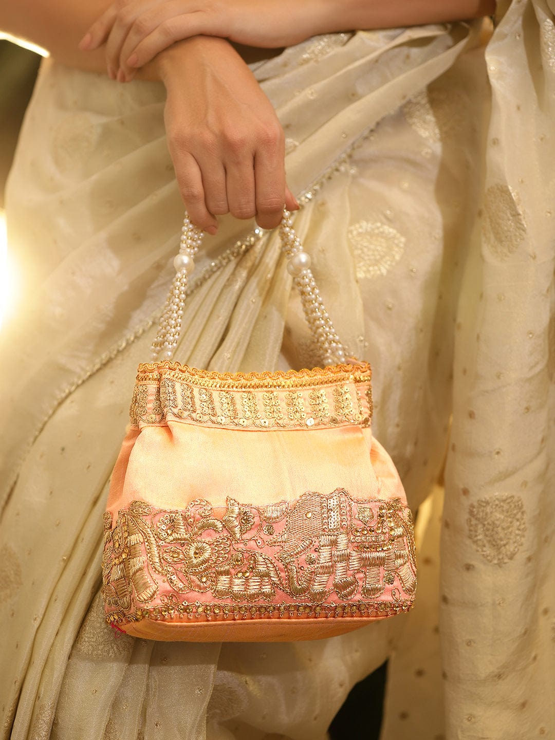 rubans-handcrafted-peach-pink-silk-potli-bag-with-pearl-handle-gold-embroidered-elephant-motif-handbag-wallet-accessories-clutche-1158545761.jpg