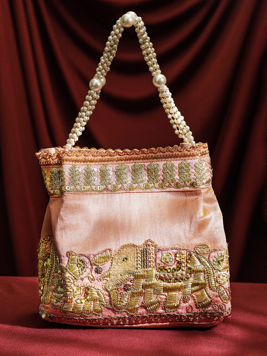 rubans-handcrafted-peach-pink-silk-potli-bag-with-pearl-handle-gold-embroidered-elephant-motif-handbag-wallet-accessories-clutche-1158545763.jpg