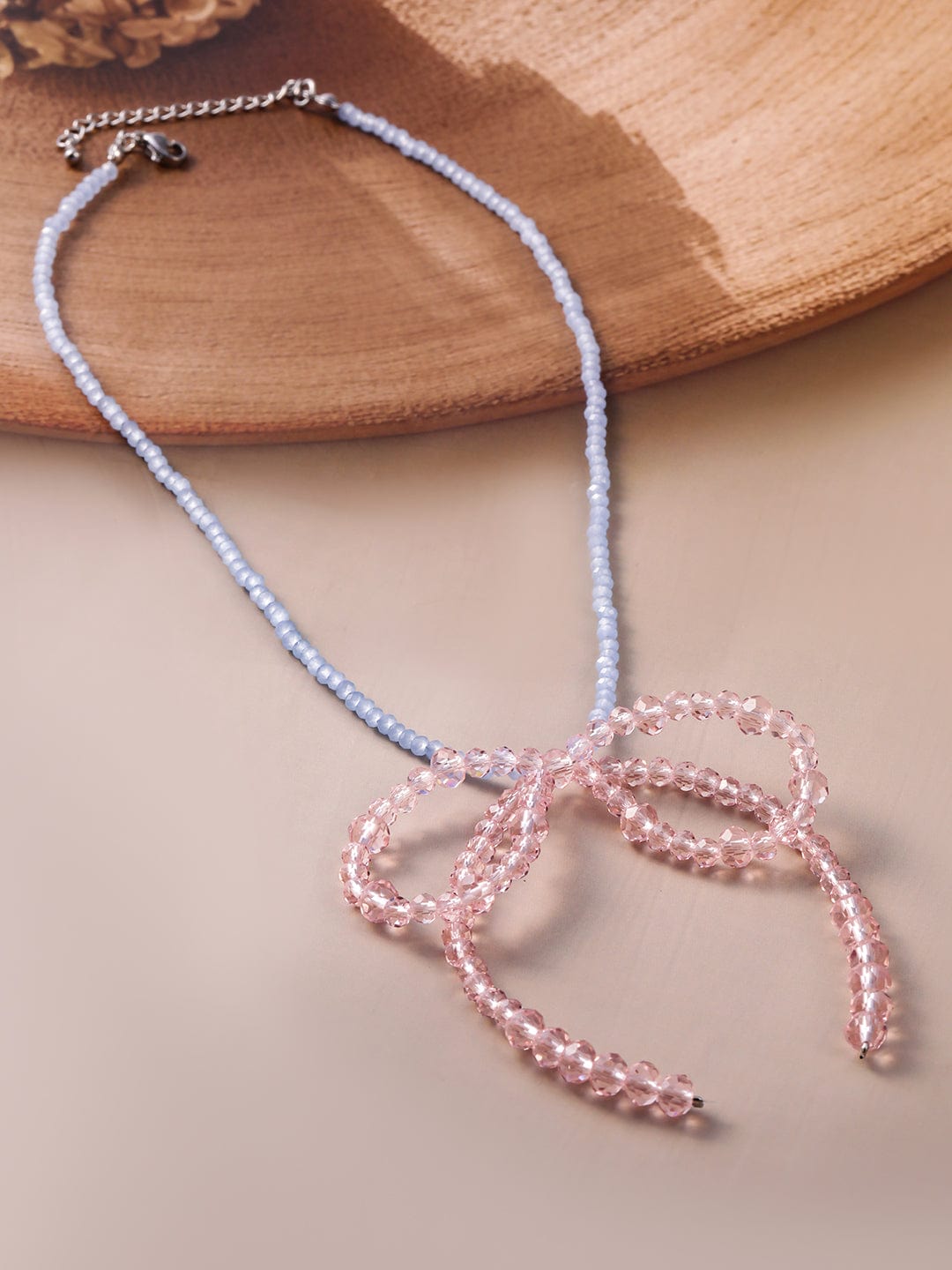 rubans-hodium-plated-blue-beaded-necklace-with-pink-crystal-bow-pendant-necklace-chain-37322968989870.jpg