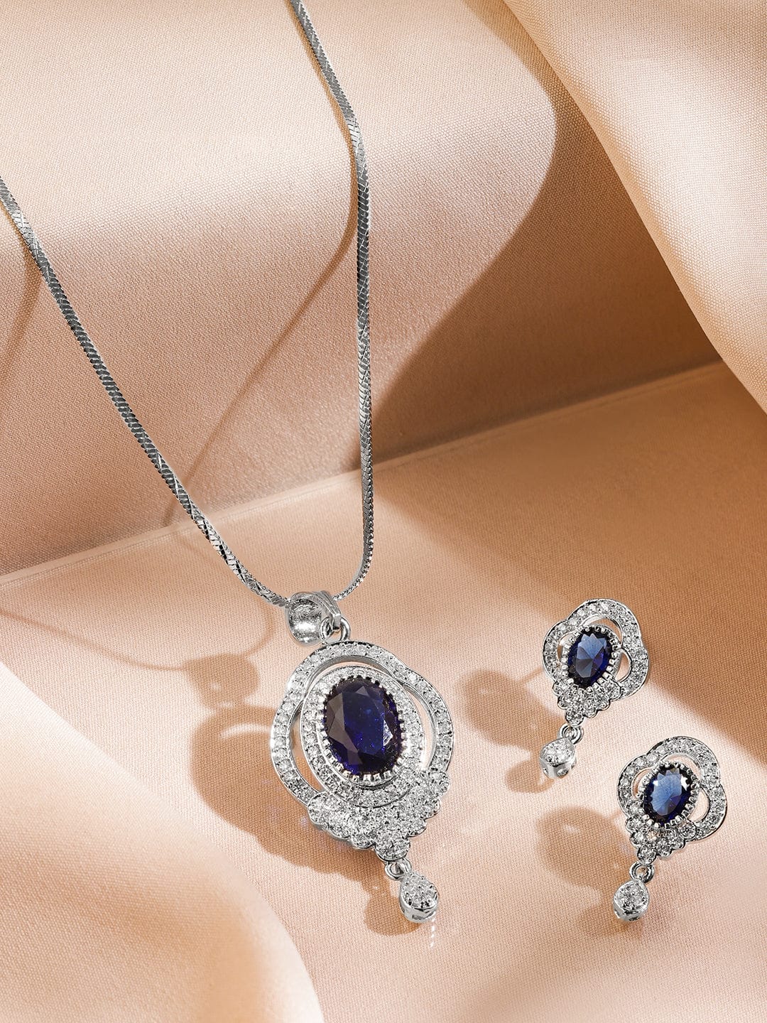rubans-rhodium-plated-blue-sapphire-cubic-zirconia-studded-oval-statement-pendant-necklace-set-pendant-set-1180850989.jpg