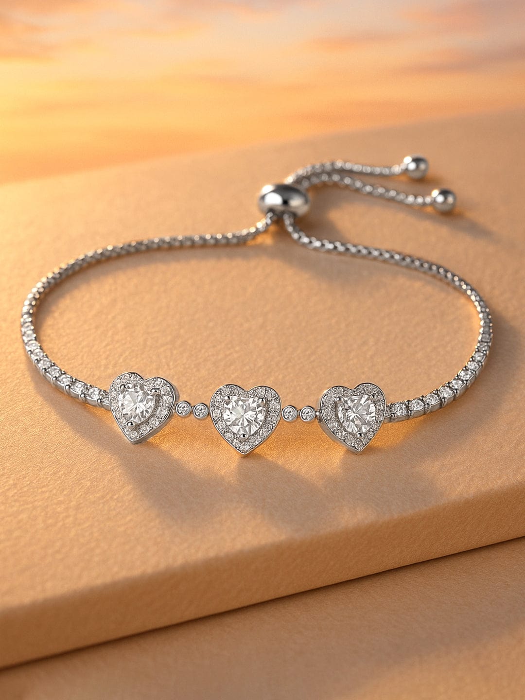 rubans-rhodium-plated-cubic-zirconia-studded-heart-adjustable-chain-charm-bracelet-bracelet-1170934993.jpg