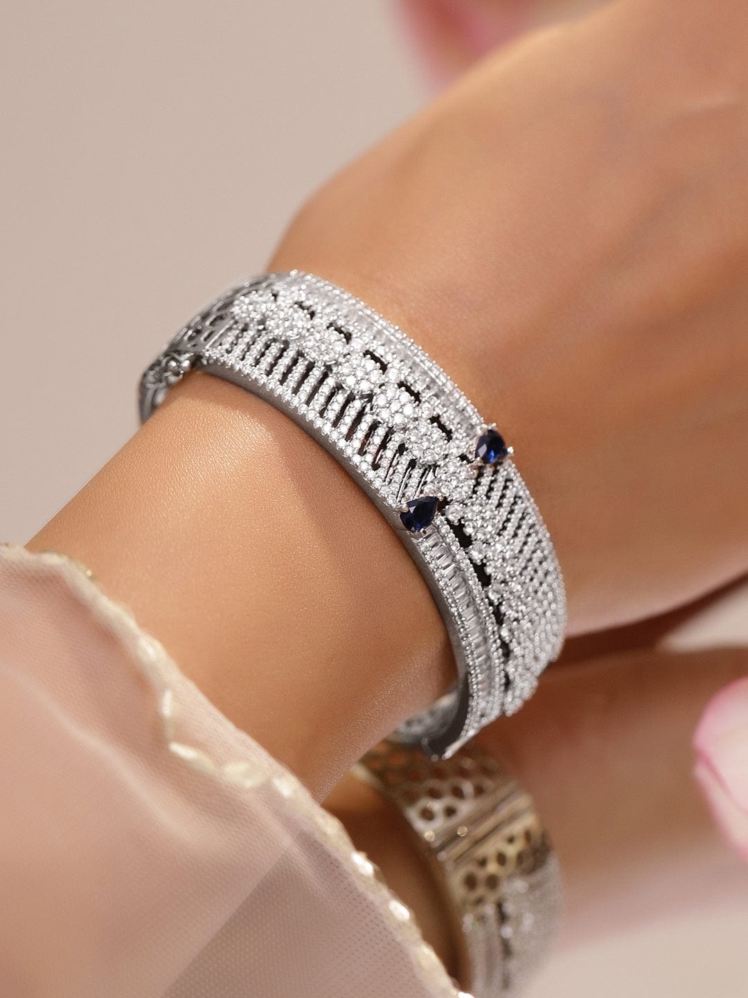 Rhodium-Plated Floral Design Bracelet with Blue Sapphire & Cubic Zirconia Accents