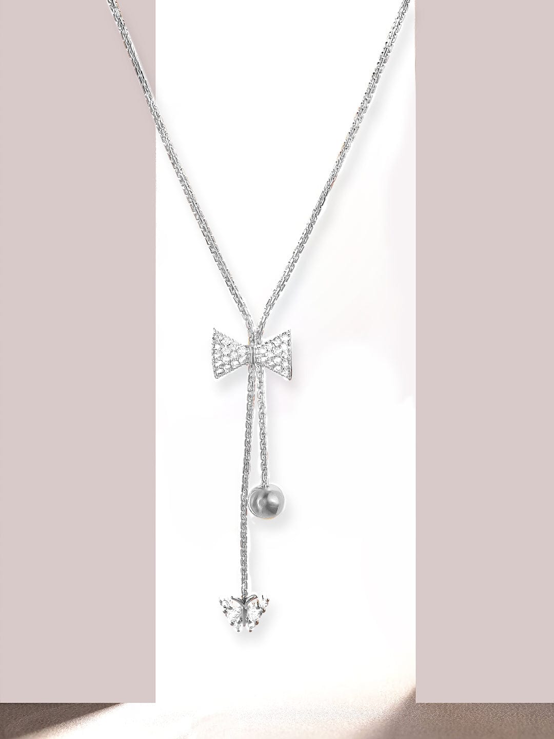Rhodium Plated, Minimal Chain Bow Motif Zircons Studded Drop Necklace. - Silver