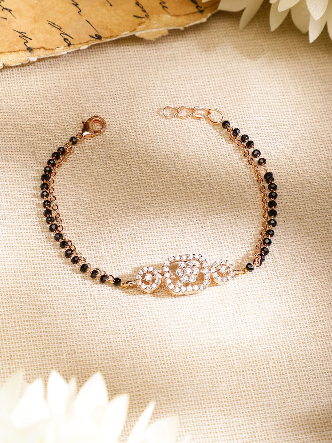 rubans-rose-gold-plated-white-cubic-zirconia-studded-floral-mangalsutra-bracelet-with-black-beads-for-women-bangles-bracelet-1156949422.jpg