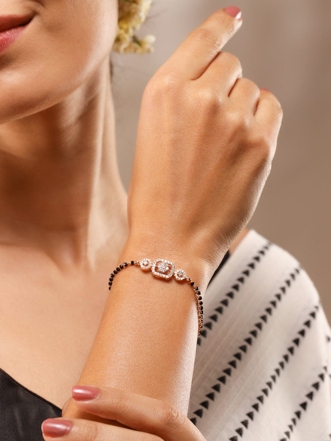 Rose Gold-Plated White Cubic Zirconia Studded Floral Mangalsutra Bracelet with Black Beads for Women